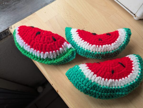Three knitted watermelons