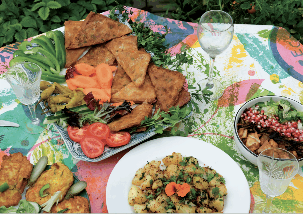 Colourful table full of various middle eastern dishes.
