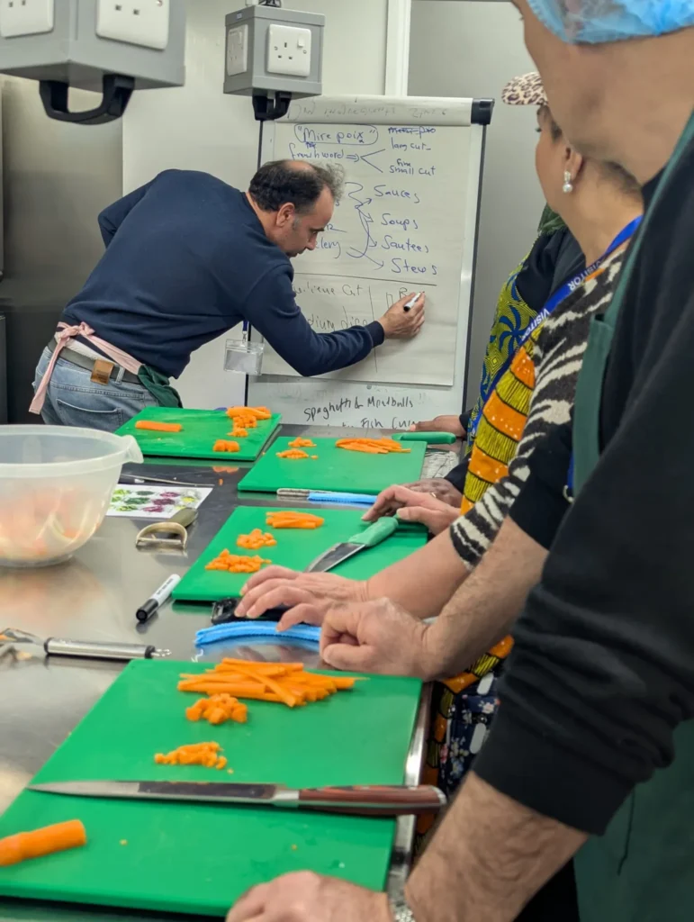 London catering tutor writing on a whiteboard