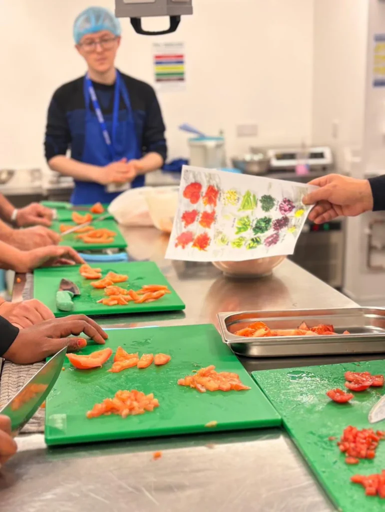 Students checking chopped vegetables