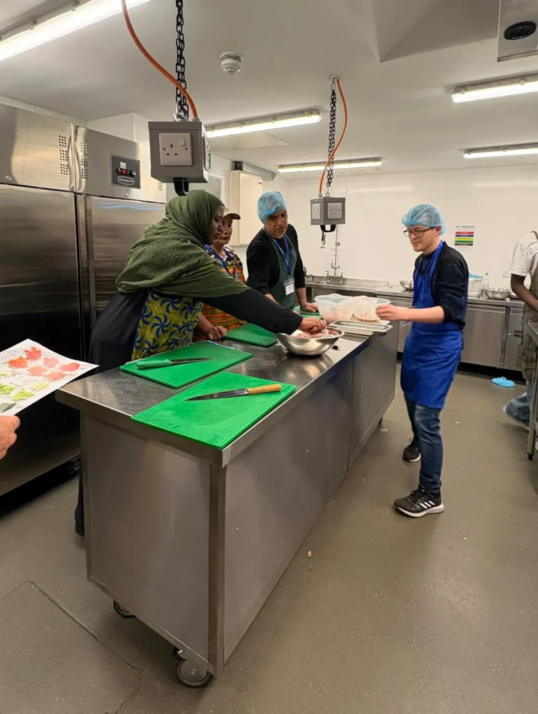 Students in the kitchen at a Plateful Cafe training session