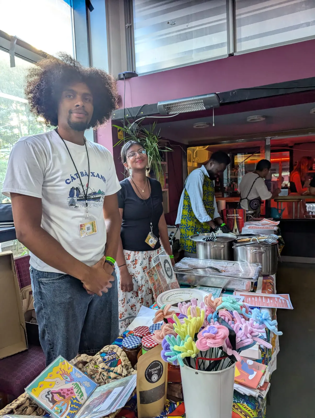 Plateful Cafe volunteers at a shop stand